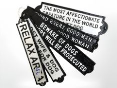 Five cast rectangular signs.