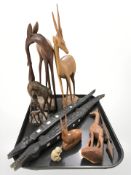A group of carved African wooden figures, gazelle, crocodiles, etc.
