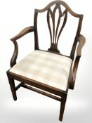 An early 19th century mahogany armchair,