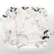 A group of new retail stock clothing, all England supporters kits, all for children,