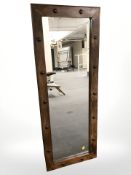 A contemporary hardwood mirror, 45 cm x 122 cm.