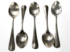 Two sets of five silver teaspoons.