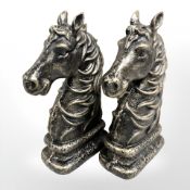 A pair of iron horse head bookends.