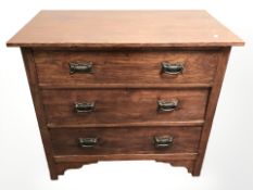 An Edwardian stained beech wood three drawer chest,