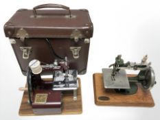 Two vintage miniature sewing machines, one in case (electrified).