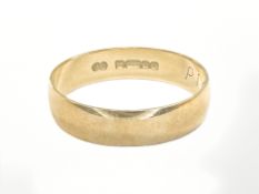 An 18ct yellow gold band ring, size L. CONDITION REPORT: 1.