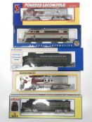 A group of five model locomotive engines to include a Bachmann HO scale diesel locomotive