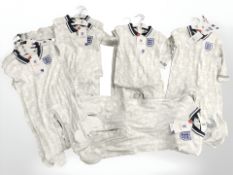 A group of new retail stock clothing, all England supporters kits, all for children,