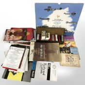 A box containing a quantity of theatre programmes, boxed cigarette cards, albums of cigarette cards,