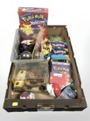 A group of Pokemon books, toys, figures, etc.