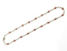 A pearl and coral necklace studded with 14ct yellow gold and clasp, length 41 cm.