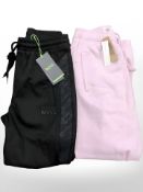 A pair of Boss XS black jogging bottoms together with a pair of pink Ivy fleece XS jogging bottoms.