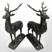 A pair of cast iron deer figures.