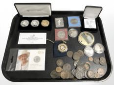 A group of coins to include, The National Lifeboat Institution five pound coin,