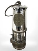 A vintage miner's lamp, numbered 111.