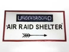 A cast metal air raid sign.