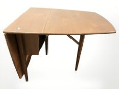 A mid 20th century teak drop leaf table,