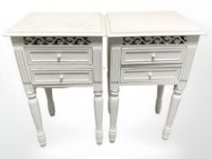 A pair of painted white twin-drawer bedside stands, width 40 cm, height 70 cm.