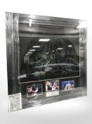 A framed pair of boxing shorts signed by Leon Spinks, Michael Spinks and Tyson Fury,