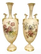 A pair of Royal Worcester blush ivory urns, shape No. 1935, height 33.