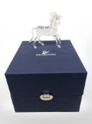 A Swarovski crystal figure of a unicorn, boxed.