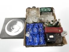 A group of glass ware including boxed wine glasses, DaVinci crystal, decanter, bottles,