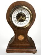 An inlaid mahogany balloon mantel clock, height 17 cm.