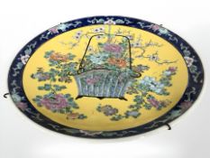 A 1950s/60s picnic set, an oriental style plate together with six tankards.