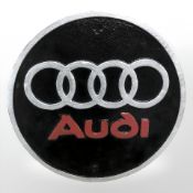 An Audi plaque.