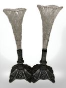 A pair of cut crystal flower vases on pewter bases, height 28 cm.