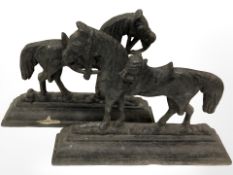 A pair of Victorian cast iron door stops modelled as shire horses.