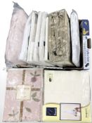 A quantity of new stock items including double quilt set, a pack of fully lined curtains, bedding,