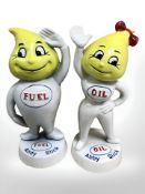 A cast iron figure of Andy Slick and Abby Slick.