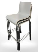 A stack of 3 ply bar chairs
