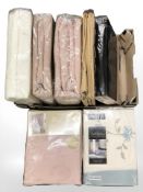 Seven packs of new curtains.