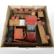 A group of vintage wooden toys, a Jones tin plated crane, etc.