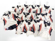 A quantity of new retail stock clothing, all children's England sports kits, all parts new.