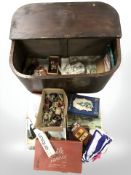 An early 20th century oak and ply box containing toys, jigsaw puzzles, animal figures,