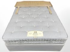 A Hypnos back rest select 4ft 6 divan set, with cane pine headboard.