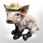 A cast figure of a pig.