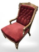 A late Victorian walnut nursing chair,