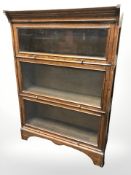A 1920's Globe-Wernicke style oak three tier stacking bookcase,