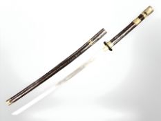 A vintage Japanese katana in brass mounted scabbard