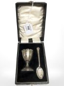 A silver egg cup and spoon, Birmingham, 1930.