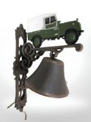A cast metal Land Rover bell on bracket.