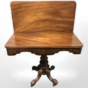 A Victorian mahogany turnover top card table,
