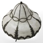 A vintage glass metal bound light shade,