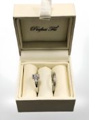 A 9ct white gold diamond cluster ring and half eternity ring, size O, in retail box.