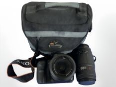 A Sony A200 camera, together with additional Sigma zoom lens.