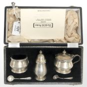 A three piece silver condiment set with spoons, Lindisfarne range, Birmingham, 1960, cased.